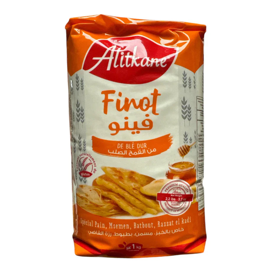 A 1 kg package of Allikane Finot De Ble Dur, a Moroccan durum wheat flour blend. The packaging features a white background with orange and red accents, displaying the brand name 'Allikane' in a red logo at the top, the product name 'Finot' in orange, and an illustration of golden-brown flatbreads at the bottom.