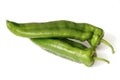 Italian green peppers on a white background