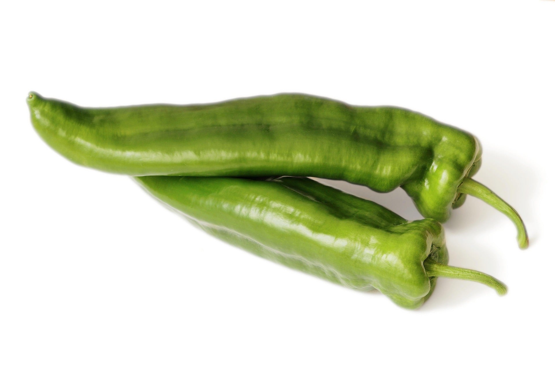 Italian green peppers on a white background