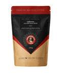 A 250g stand-up pouch of Sacarello Sabroso coffee, featuring a black and kraft brown design with red accents and the Sacarello 1888 logo.