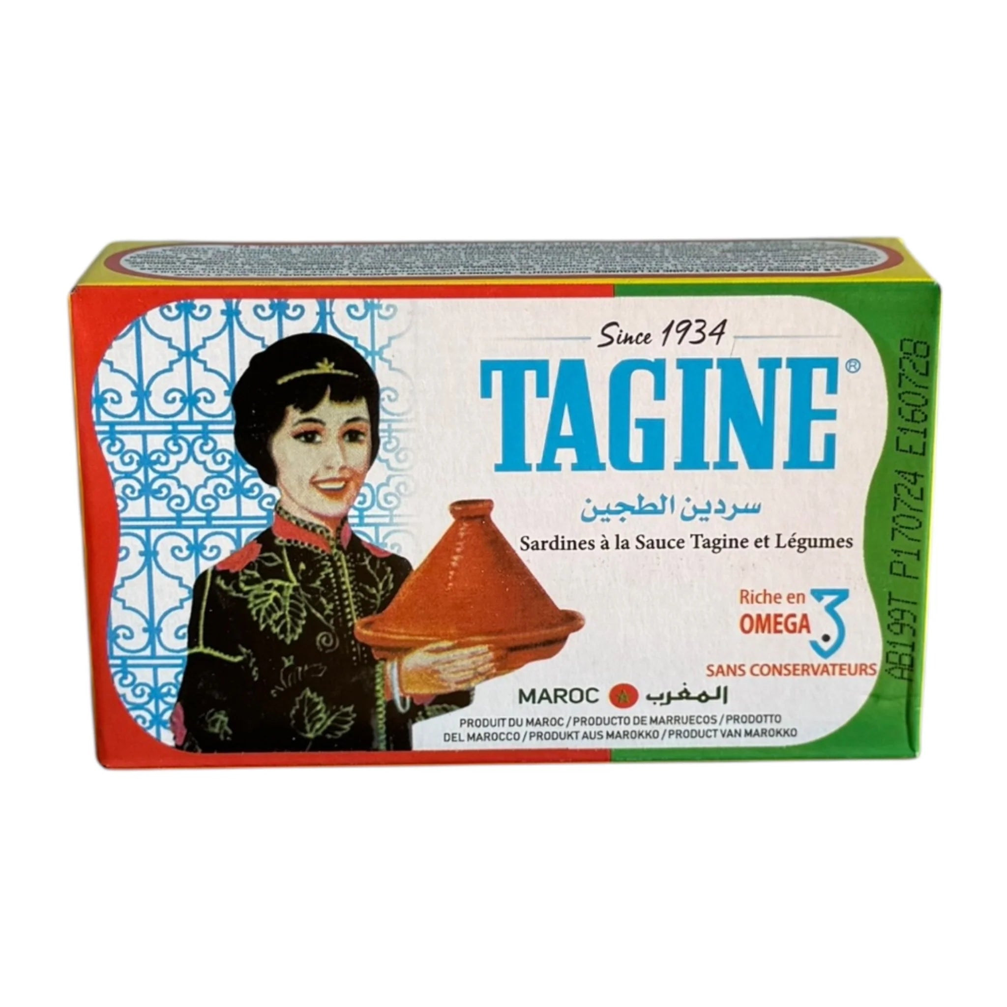 A boxed food product labeled TAGINE, shown against a plain white background. The front of the package features a vintage-style illustration of a woman holding a red-orange tagine pot, with blue branding text and green side panels.