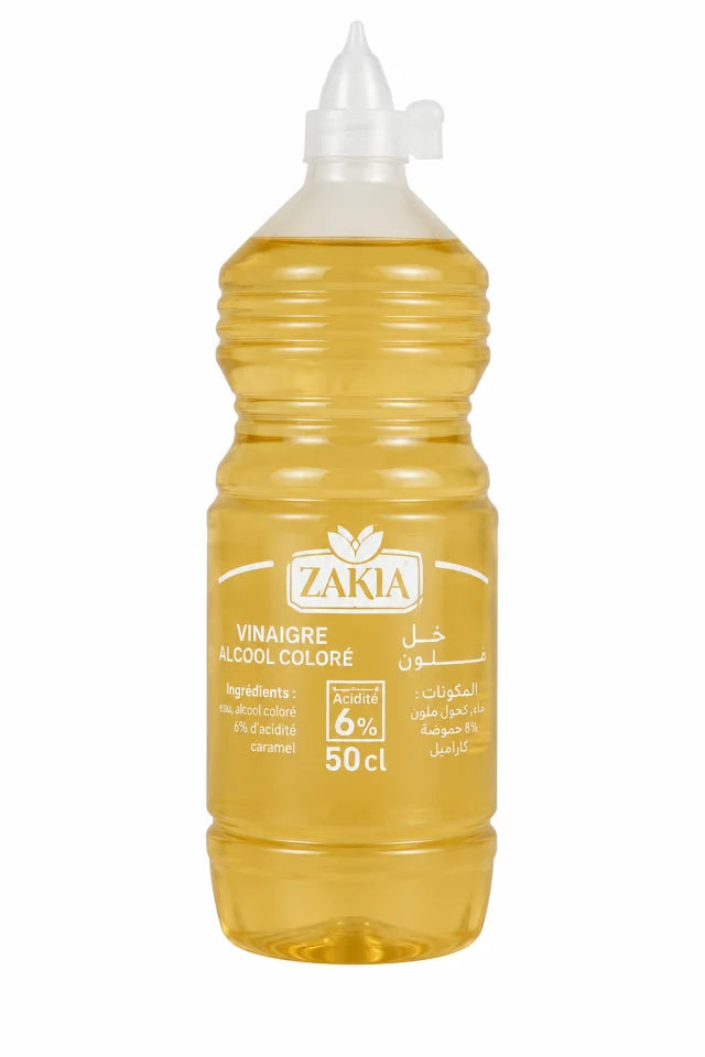 A 50 cl squeeze bottle of ZAKIA colored alcohol vinegar (Vinaigre Alcool Coloré) filled with golden yellow liquid, featuring a white cap and label, on a white background.