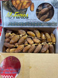 A 1kg open cardboard box of Al-Fares sweet dates, showing rows of brown dates inside alongside a clear window displaying more dates. The top of the box features a decorative label with the brand name 'Al-Fares' and product details.