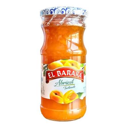 A glass jar of El Baraka Abricot (apricot) jam with a white and blue patterned lid and a white label featuring apricot illustrations, set against a plain white background.