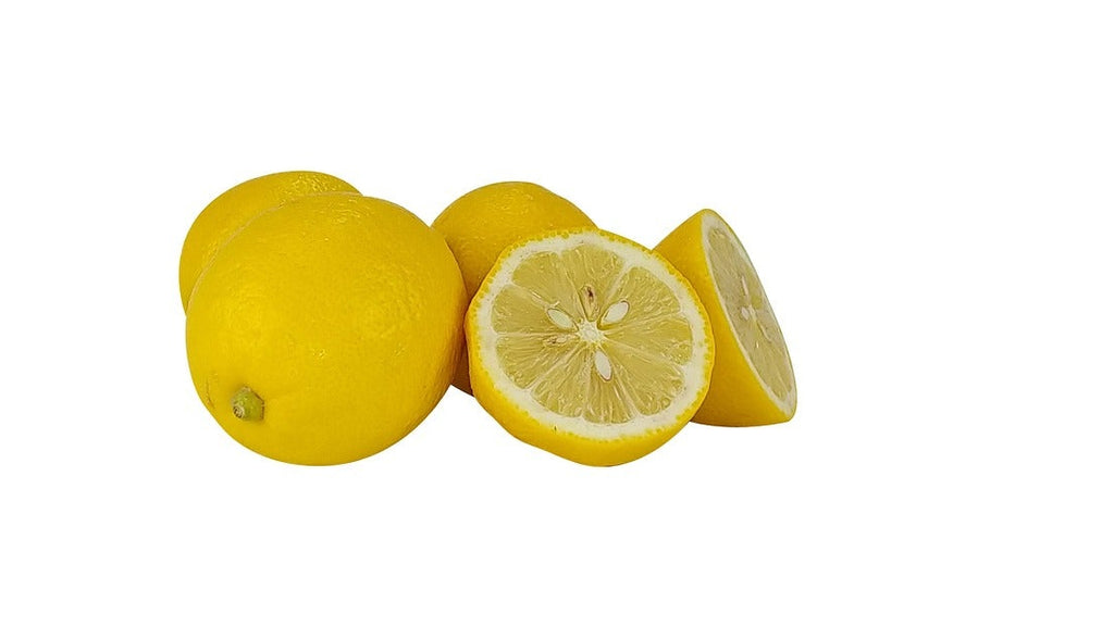 Three yellow lemons on a plain white background, including one whole lemon, one cut lemon showing the inside, and one partially visible behind them.