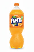 A bottle of Fanta Orange soda from Morocco on a plain white background. The clear plastic bottle is filled with bright orange soda and features the classic Fanta logo on the front label with an orange slice graphic.
