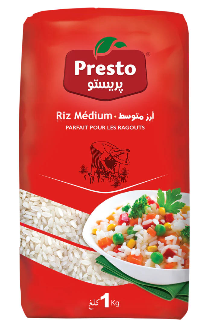 A 1 kg bag of Presto Riz Médium rice, featuring its signature red packaging with a clear window showing the white rice grains inside, alongside a serving suggestion of mixed vegetable rice.