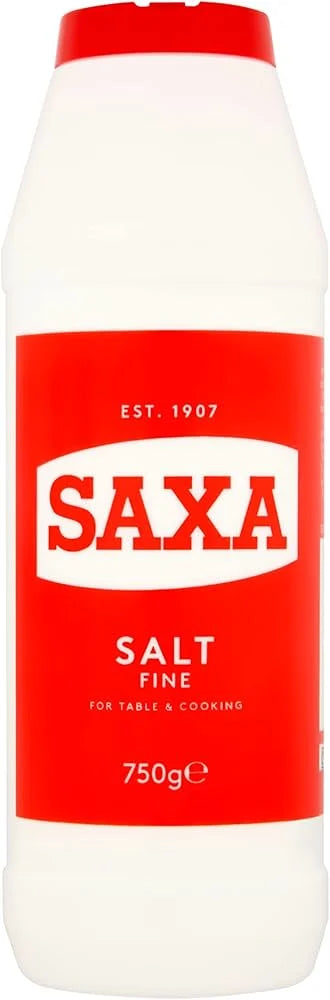 A 750g bottle of SAXA Salt Fine, featuring a white plastic container with a red cap and a bold red label with white text.