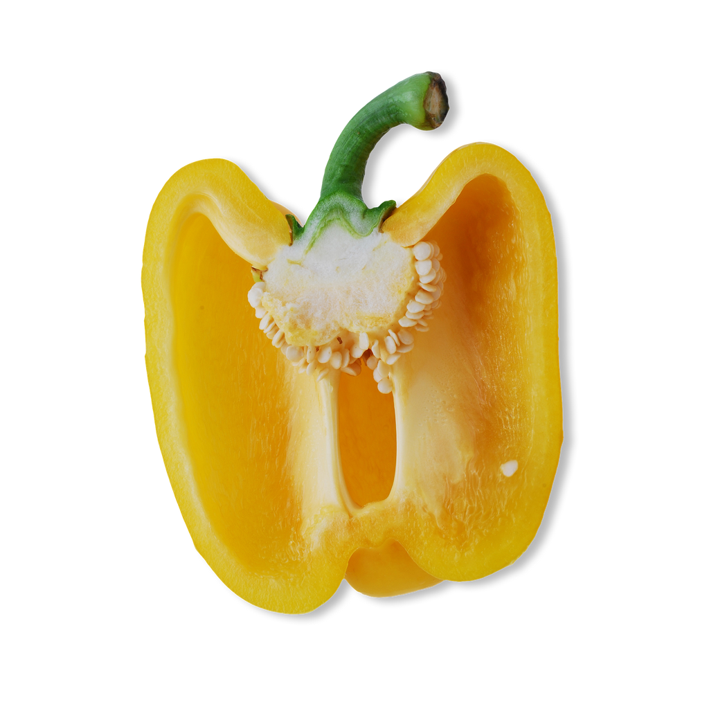 A halved yellow bell pepper with a green stem, showing the white core and seeds, isolated on a white background.